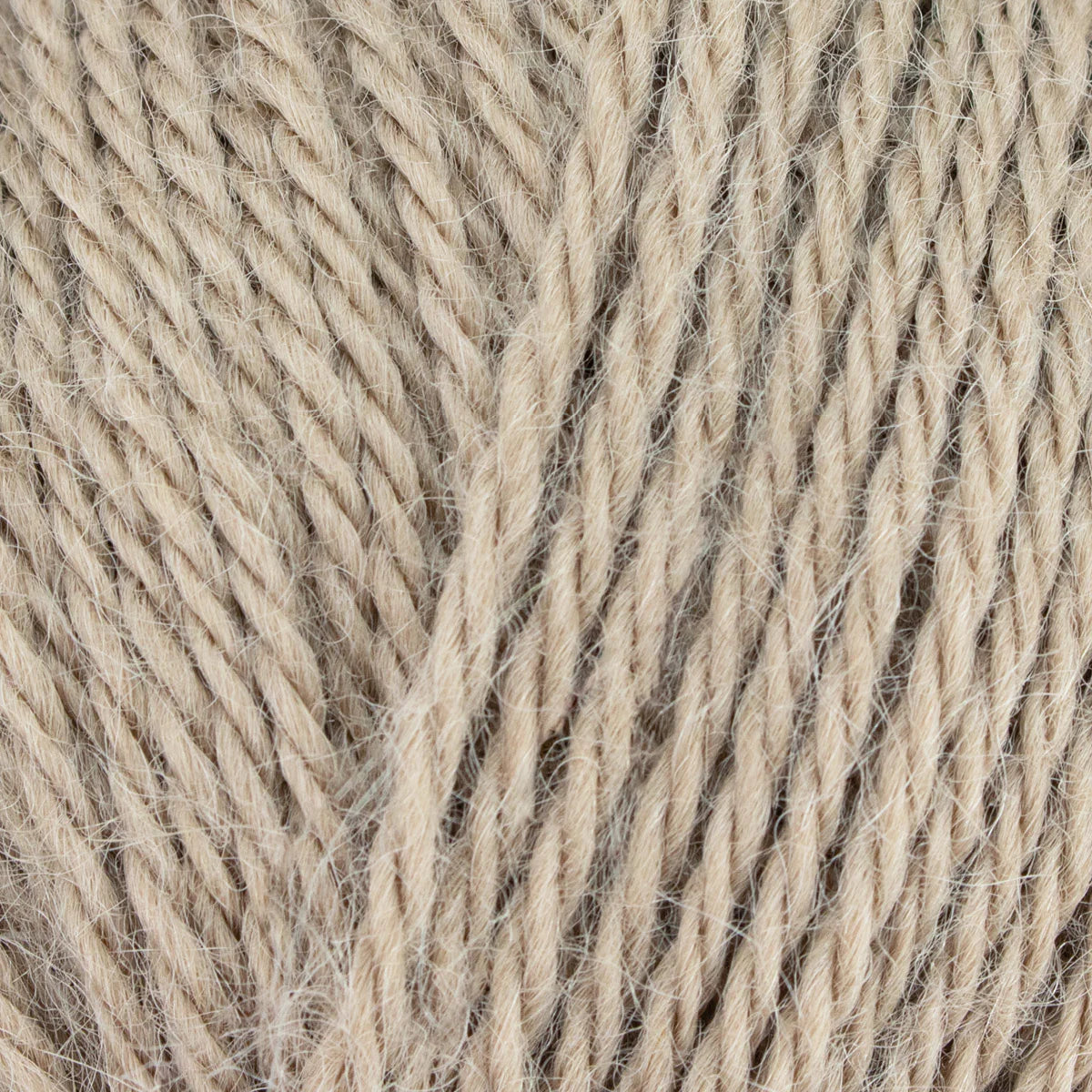 Close-up of beige yarn with visible texture
