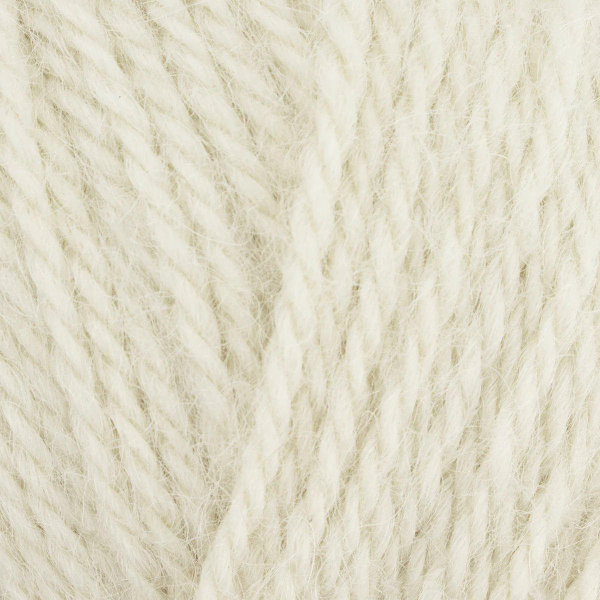 Close-up of beige yarn with a textured pattern