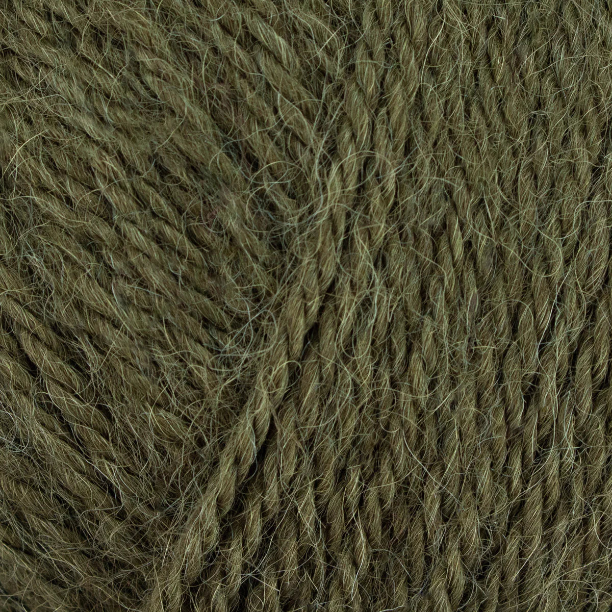 Close-up of a ball of dark green yarn
