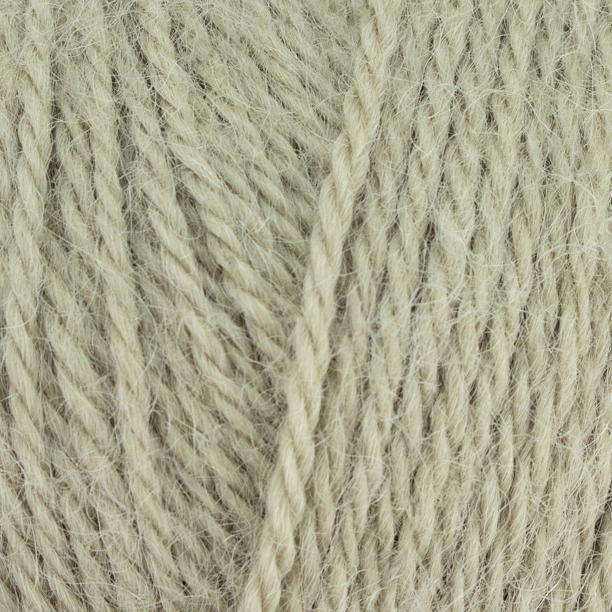 Close-up of beige yarn with a textured pattern