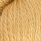 Close-up of beige yarn with a focus on texture